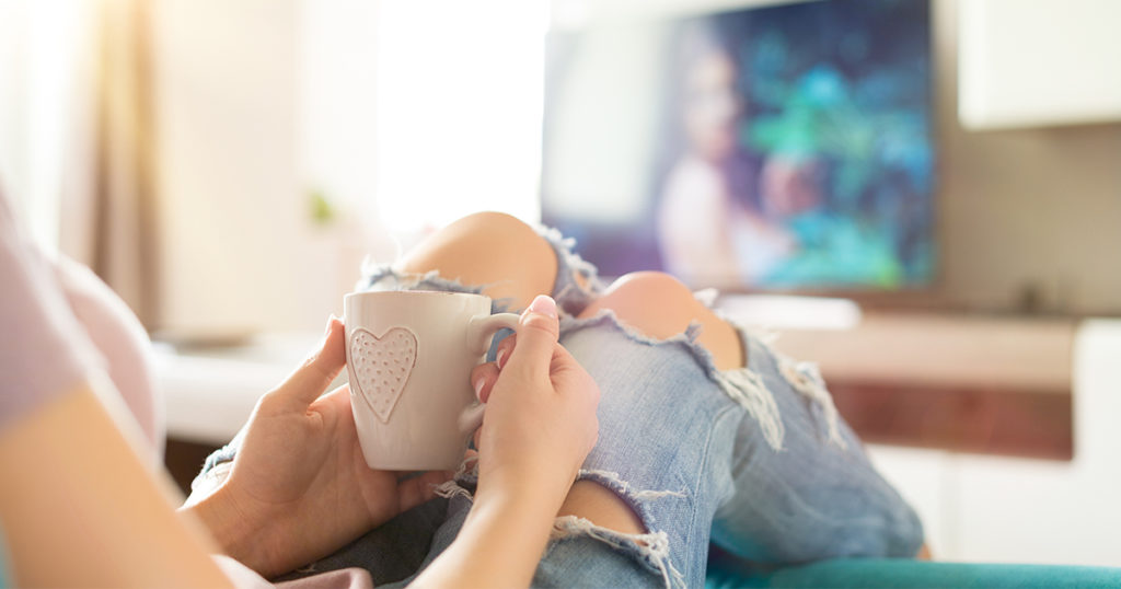 Image of a woman watching tv - Anxiety change #5 Sedentary lifestyle.
