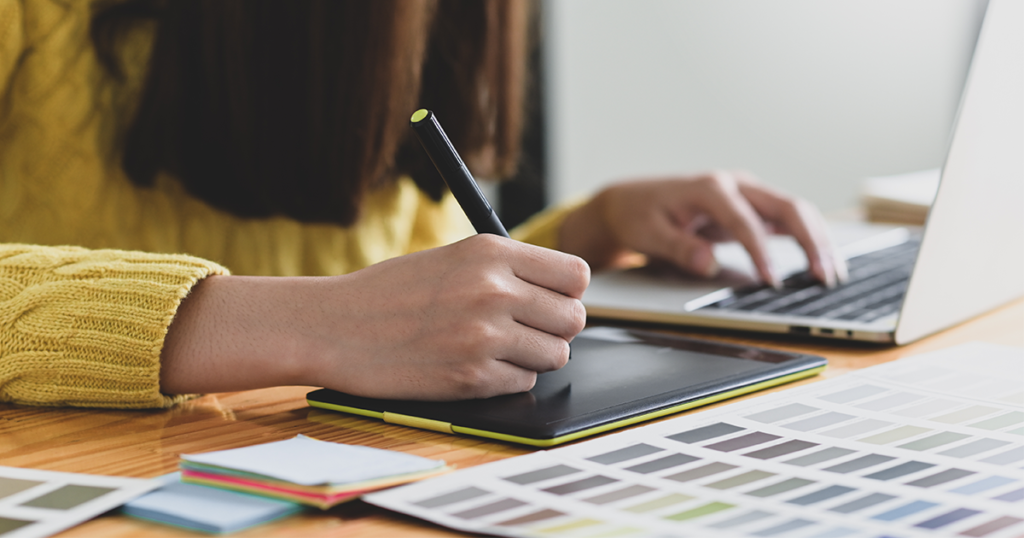 graphic designer sketching on tablet